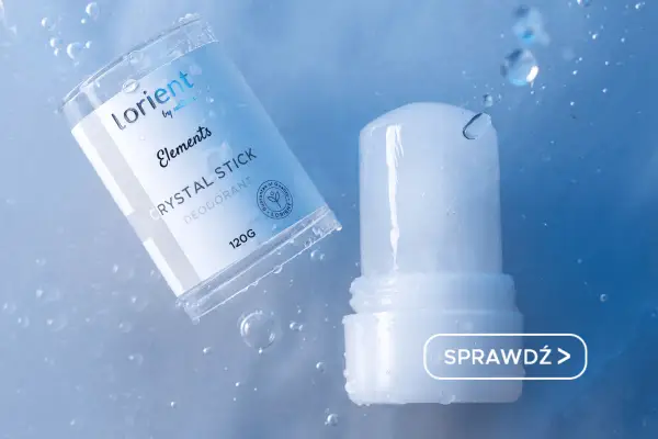 Dezodorant Lorient Crystal Stick, naturalny ałun co to? Przezroczysty sztyft w opakowaniu, otoczony kroplami wody.